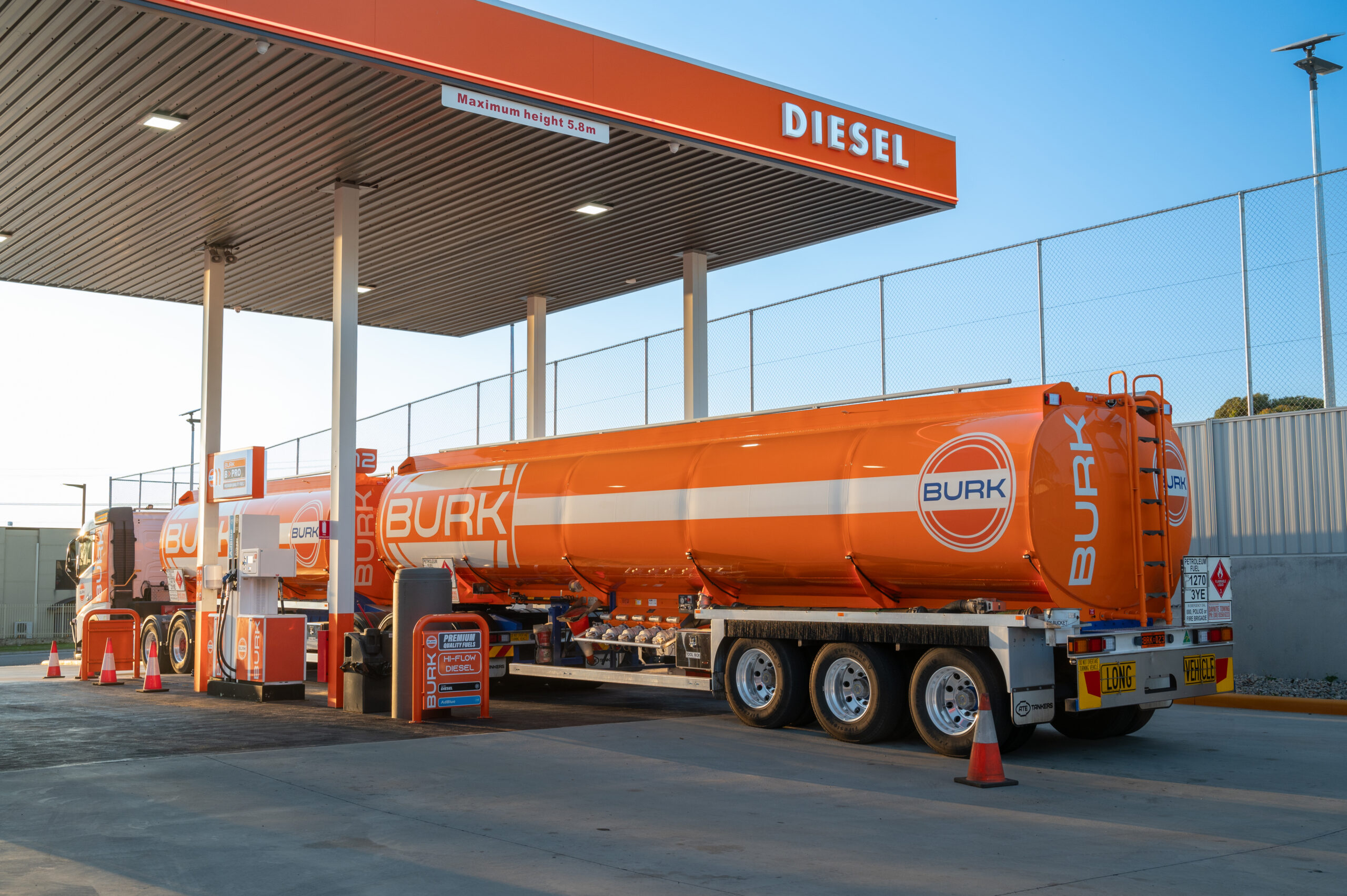 Burk diesel tanker truck refueling at a diesel-only service station.